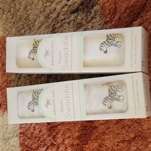 2 zebra muslin swaddles